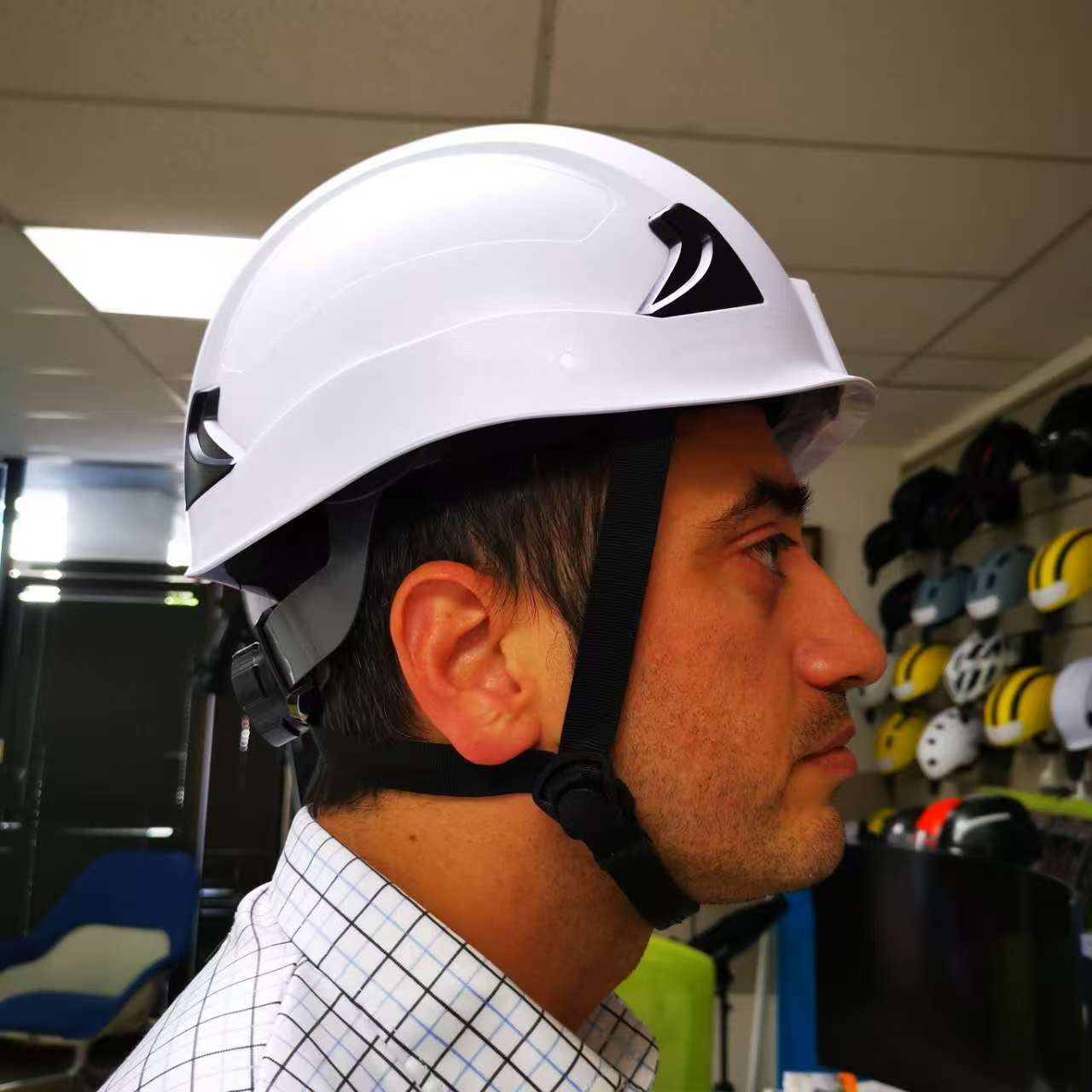 Right side view of man wearing white M10 Frontier Type II Class C Safety Helmet , ANSI/ISEA Z89.1-2014 certifications. Type 2 helmet for use in construction, Construction, Arbor, and Industrial Work.