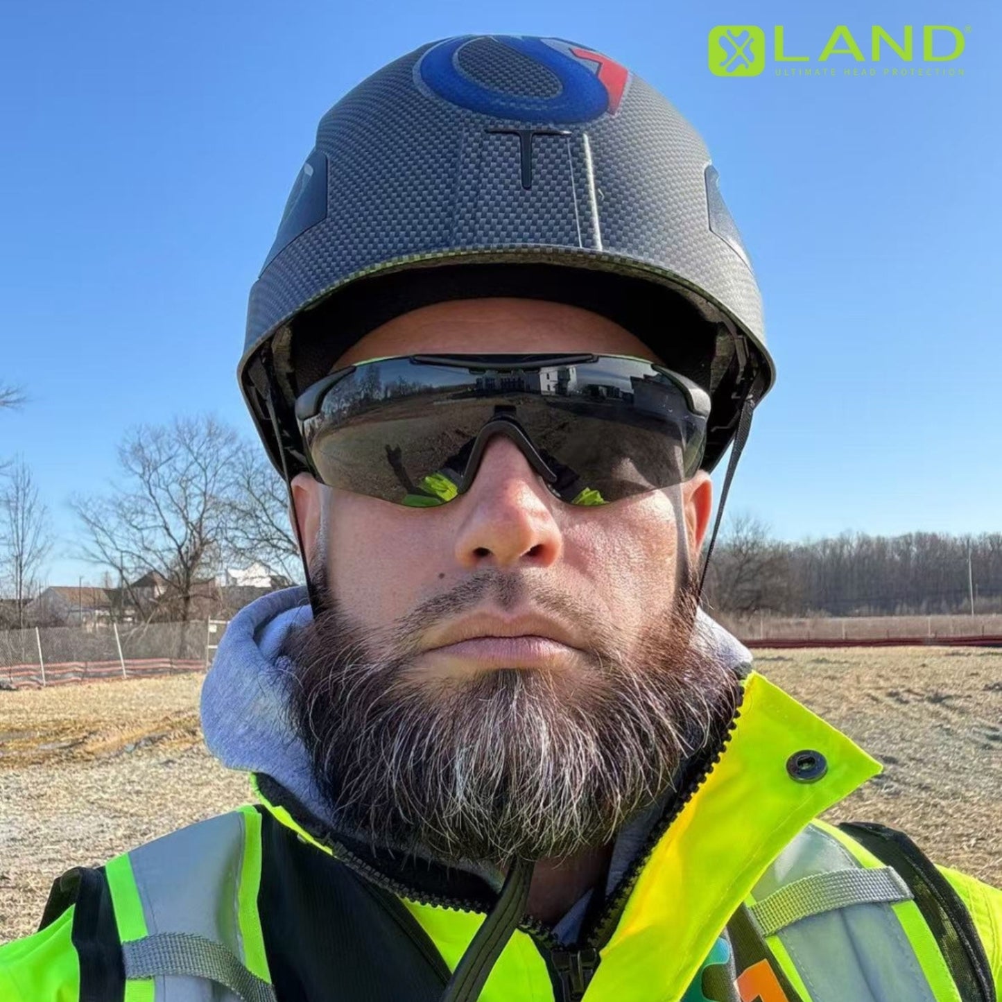 Construction worker taking selfie wearing carbon fiber M10 Frontier Type II Class C Safety Helmet , ANSI/ISEA Z89.1-2014 certifications. Type 2 helmet for use in construction, Construction, Arbor, and Industrial Work.