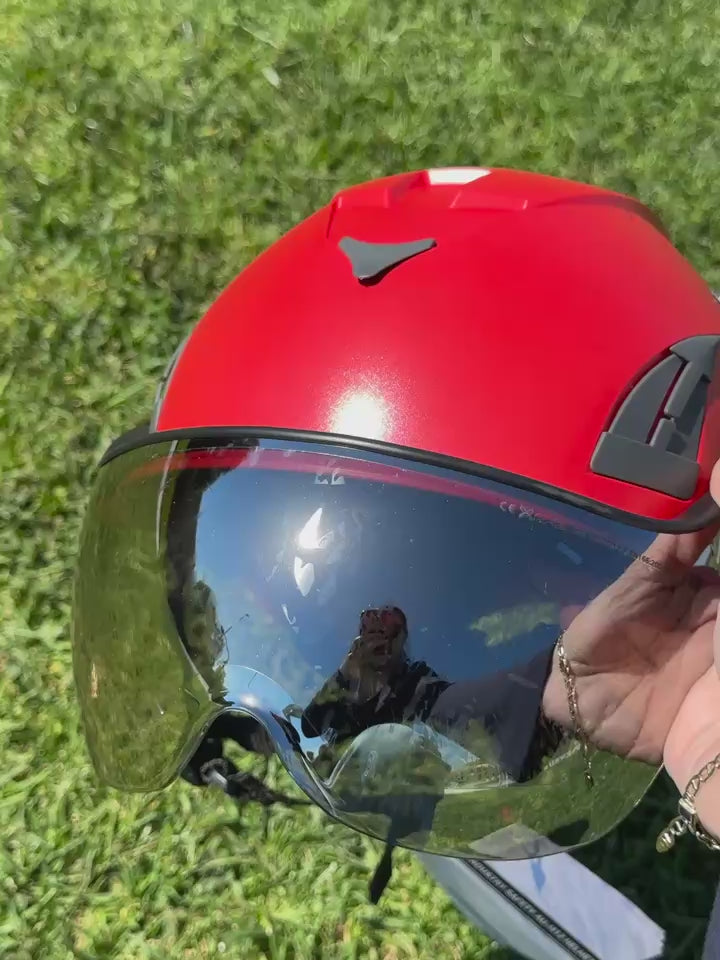 Video of red AeroPro Safety Helmets with Smoke Visor Kit on Grass. ANSI/ISEA Z89.1-2014 Type 1 Class C Safety Helmet with Smoke Visor used for Construction, Rescue & Arborist.