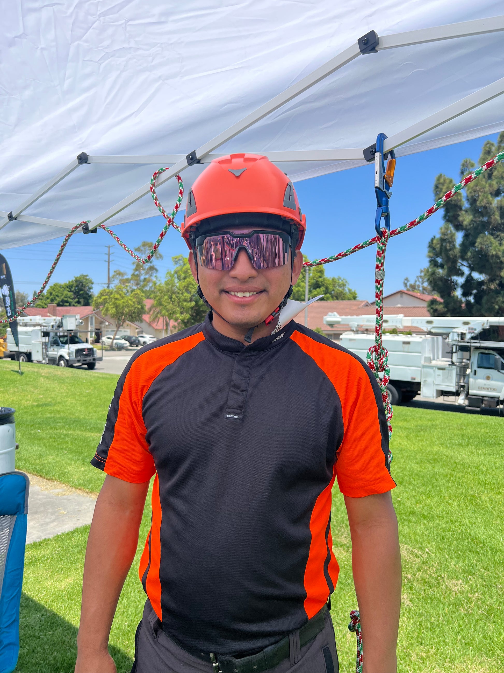 Cconstruction worker with orange  AeroPro Safety Helmet ANSI/ISEA Z89.1-2014 OSHA Certified Type 1 Class C.